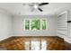 View of the living room featuring hardwood floors, and large windows at 335 Cedar Ln, Fayetteville, GA 30214