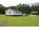 View of house with a deck, and a pool at 124 Wynn Rd, Mcdonough, GA 30252