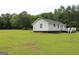 Home with a spacious lawn and a walkout deck at 124 Wynn Rd, Mcdonough, GA 30252