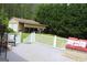 Backyard featuring an outdoor patio, shed, and well-manicured lawn at 124 Wynn Rd, Mcdonough, GA 30252