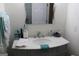Bright bathroom with updated marble vanity, sink, and faucet with decorative mirror and fixtures at 124 Wynn Rd, Mcdonough, GA 30252