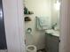 Neat half-bathroom with updated vanity, faucet, light fixture and commode at 124 Wynn Rd, Mcdonough, GA 30252