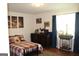 Welcoming bedroom featuring a comfortable bed, dresser, and accent decor at 124 Wynn Rd, Mcdonough, GA 30252