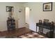 Cozy bedroom features wood floors, a classic table, and a comfortable bed at 124 Wynn Rd, Mcdonough, GA 30252