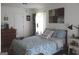 Cozy bedroom features wood floors, dresser, natural light, and a comfortable bed at 124 Wynn Rd, Mcdonough, GA 30252