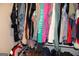 The closet features clothes hanging on racks at 124 Wynn Rd, Mcdonough, GA 30252