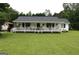 Charming single-Gathering home with a covered front porch, set on a lush green lawn at 124 Wynn Rd, Mcdonough, GA 30252
