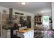Bright kitchen with an island, updated appliances, and an eat-in area at 124 Wynn Rd, Mcdonough, GA 30252