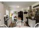 Bright kitchen showcasing white cabinetry, modern countertops, and updated appliances at 124 Wynn Rd, Mcdonough, GA 30252