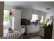 Charming kitchen with white cabinets, updated countertops, and stainless steel appliances at 124 Wynn Rd, Mcdonough, GA 30252