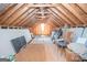 Spacious attic with wooden beams and plywood flooring at 531 Grant Rd, Brooks, GA 30205