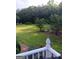 Large, green, fenced back yard with landscaping at 531 Grant Rd, Brooks, GA 30205