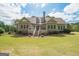 Backyard of a large one-story home with a staircase at 531 Grant Rd, Brooks, GA 30205