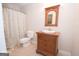 Charming bathroom features a vanity with traditional design, a patterned shower curtain and an oval mirror at 531 Grant Rd, Brooks, GA 30205