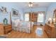 Cozy bedroom with wooden floors, bright windows, and a lovely floral-patterned bed at 531 Grant Rd, Brooks, GA 30205