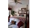 Luxurious primary bedroom with a four-poster bed and a cozy seating area at 531 Grant Rd, Brooks, GA 30205