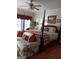 Comfortable bedroom with four poster bed, a seating area and lots of natural light at 531 Grant Rd, Brooks, GA 30205
