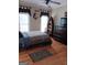 Comfortable bedroom with wood floors, ceiling fan, and unique decorative touches at 531 Grant Rd, Brooks, GA 30205