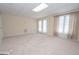 Versatile bonus room with neutral carpet, natural light and exterior access through double doors at 531 Grant Rd, Brooks, GA 30205