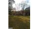 Beautiful home surrounded by mature trees on a large, landscaped lot at 531 Grant Rd, Brooks, GA 30205