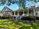 Charming home with a large, inviting front porch and well-manicured lawn at 531 Grant Rd, Brooks, GA 30205