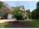 Charming single-Gathering home with stone accents, a two-car garage, and beautifully landscaped yard at 531 Grant Rd, Brooks, GA 30205