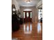 Inviting foyer with hardwood floors and decorative front door at 531 Grant Rd, Brooks, GA 30205