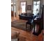 Comfortable living room with sofa, piano and hardwood floors at 531 Grant Rd, Brooks, GA 30205