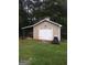Garage in the back yard with a lawnmower at 531 Grant Rd, Brooks, GA 30205