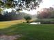 Beautiful pond surrounded by an open, grassy area, perfect for peaceful enjoyment at 531 Grant Rd, Brooks, GA 30205