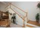 Bright foyer featuring a staircase with white railings leading to the upper level and hardwood floors at 531 Grant Rd, Brooks, GA 30205