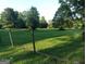 A large grassy yard with a fence featuring wooden posts and wire, adding a rustic touch at 531 Grant Rd, Brooks, GA 30205