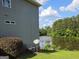 The home features a backyard with a peaceful lake view and an inviting landscape with mature trees, offering serene outdoor living at 3932 Misty Lake, Ellenwood, GA 30294