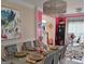 A formal dining room showcases a glamorous chandelier and a table set for a dinner party, enhancing the home's elegance at 3932 Misty Lake, Ellenwood, GA 30294