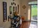 A beautifully decorated foyer boasts hardwood floors and a decorative console table adding elegance to the entrance at 3932 Misty Lake, Ellenwood, GA 30294