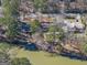 Aerial view of homes near the lake with docks and mature trees, offering serene waterfront living at 2545 Rockbridge Nw Rd, Conyers, GA 30012