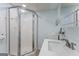 Bathroom features a shower with glass doors, a sleek sink, and modern fixtures at 2545 Rockbridge Nw Rd, Conyers, GA 30012