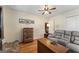 Bedroom featuring a sitting area, light walls, and hardwood flooring at 2545 Rockbridge Nw Rd, Conyers, GA 30012