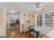 Bright dining area featuring a window view of a wooded area and hardwood floors at 2545 Rockbridge Nw Rd, Conyers, GA 30012