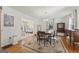 Formal dining room with hardwood floors, elegant lighting, and classic furniture at 2545 Rockbridge Nw Rd, Conyers, GA 30012