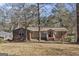 Charming single-story home featuring a brick facade, covered porch, and well-manicured yard at 2545 Rockbridge Nw Rd, Conyers, GA 30012