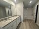 Bathroom with double vanity sinks and a tiled shower/tub combination at 20 Emerald Ln # 1, Covington, GA 30014