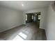 Open-concept living space with beautiful wood-look floors and a view to the Gathering room at 20 Emerald Ln # 1, Covington, GA 30014