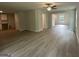 Open-concept living area with wood-look flooring, perfect for Gathering gatherings at 20 Emerald Ln # 1, Covington, GA 30014