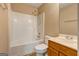 A standard bathroom features a shower-tub combo, a wood vanity, and neutral walls at 1960 Morning Nw Walk, Acworth, GA 30102