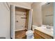 Updated bathroom features a vanity with sink, toilet, and separate closet with shelving at 1960 Morning Nw Walk, Acworth, GA 30102