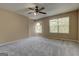 Spacious bedroom boasts soft carpet, ample natural light, and neutral colors at 1960 Morning Nw Walk, Acworth, GA 30102
