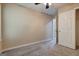 This bedroom has neutral walls, carpet flooring, and a ceiling fan at 1960 Morning Nw Walk, Acworth, GA 30102