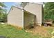 Rear view of home with wooden deck and landscaping at 1960 Morning Nw Walk, Acworth, GA 30102