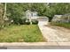 Charming two-story home with stone accents and a two-car garage nestled amongst mature trees at 1960 Morning Nw Walk, Acworth, GA 30102